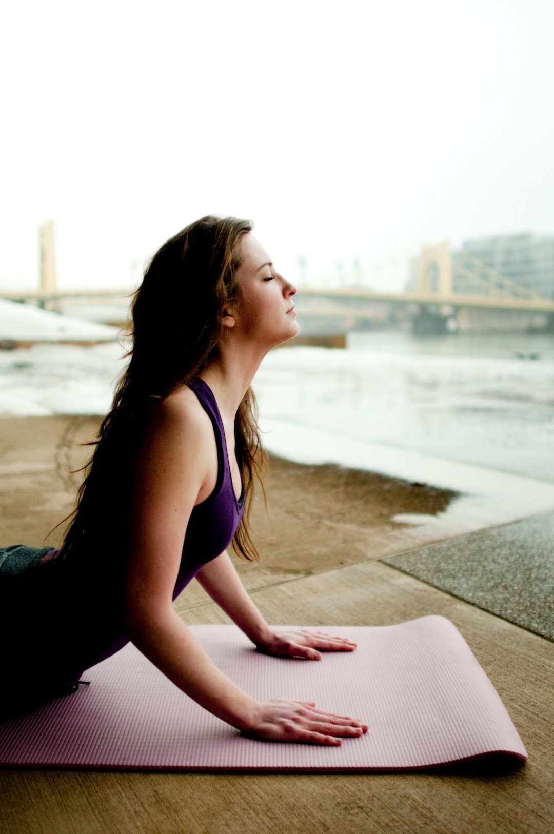 woman-in-black-tank-top-sitting-on-concrete-floor-during-daytime-czwyxv0yyee